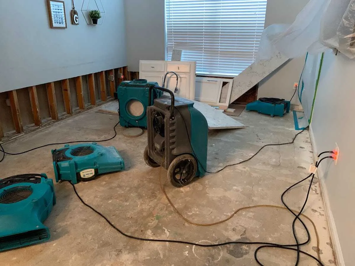 Dehumidifier in flood-cut room for Water Damage Restoration in Plano