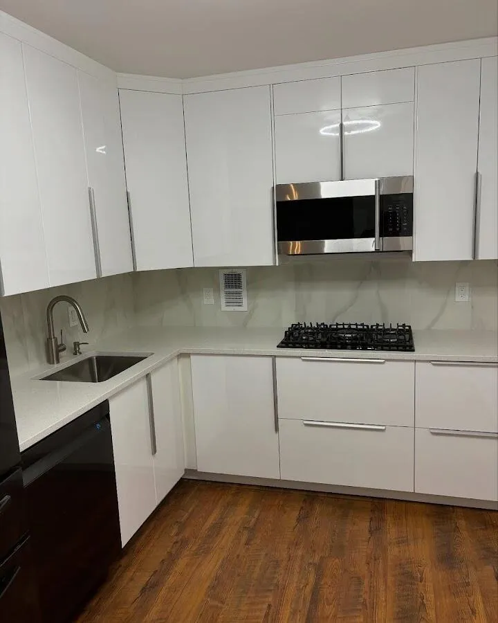 Restored kitchen with white cabinets after water damage in Plano